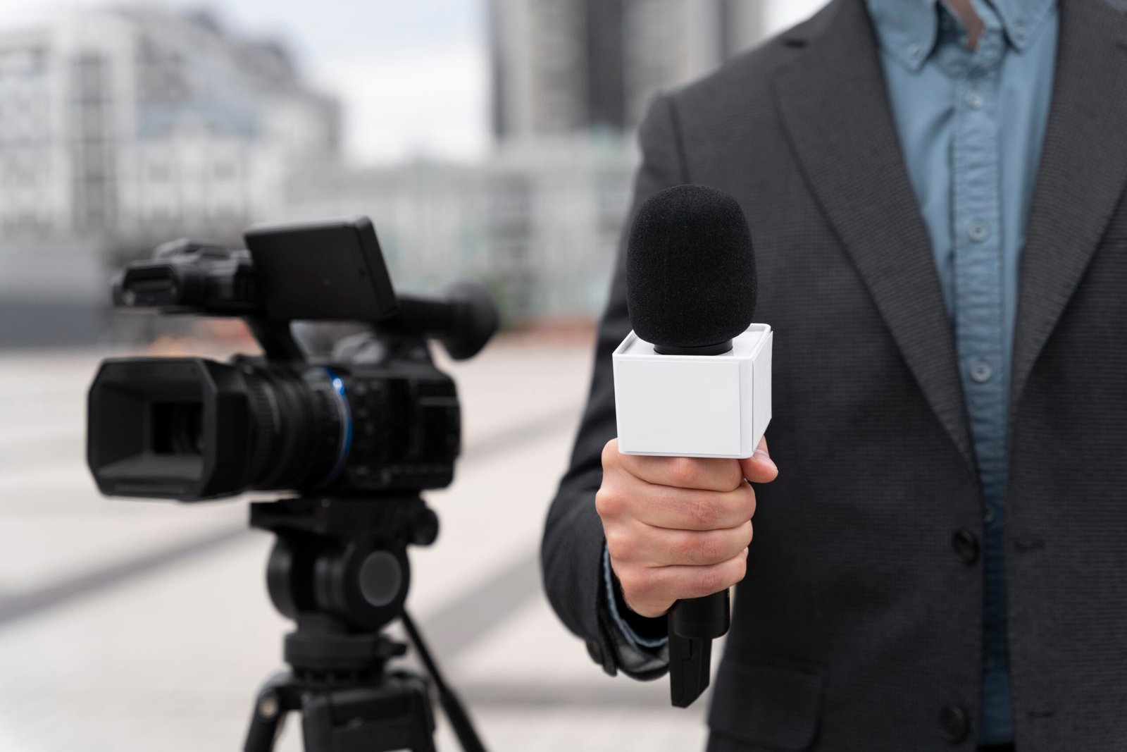 front-view-journalist-holding-microphone